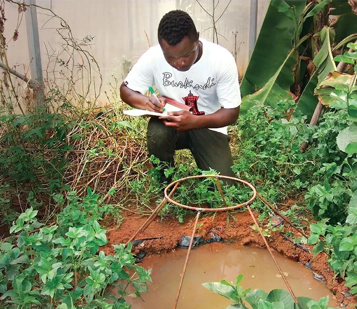 Etienne Bilgo works in field